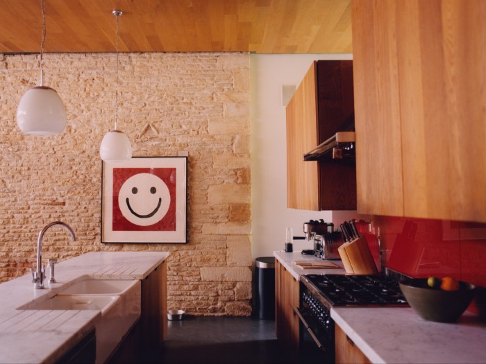 Smile and the World Smiles with You, 2018, by Jake Chapman and Dinos Chapman, hanging in the kitchen