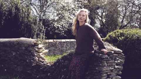 Kate Moss is wearing a Margaret Howell jumper and a Réalisation Joni dress